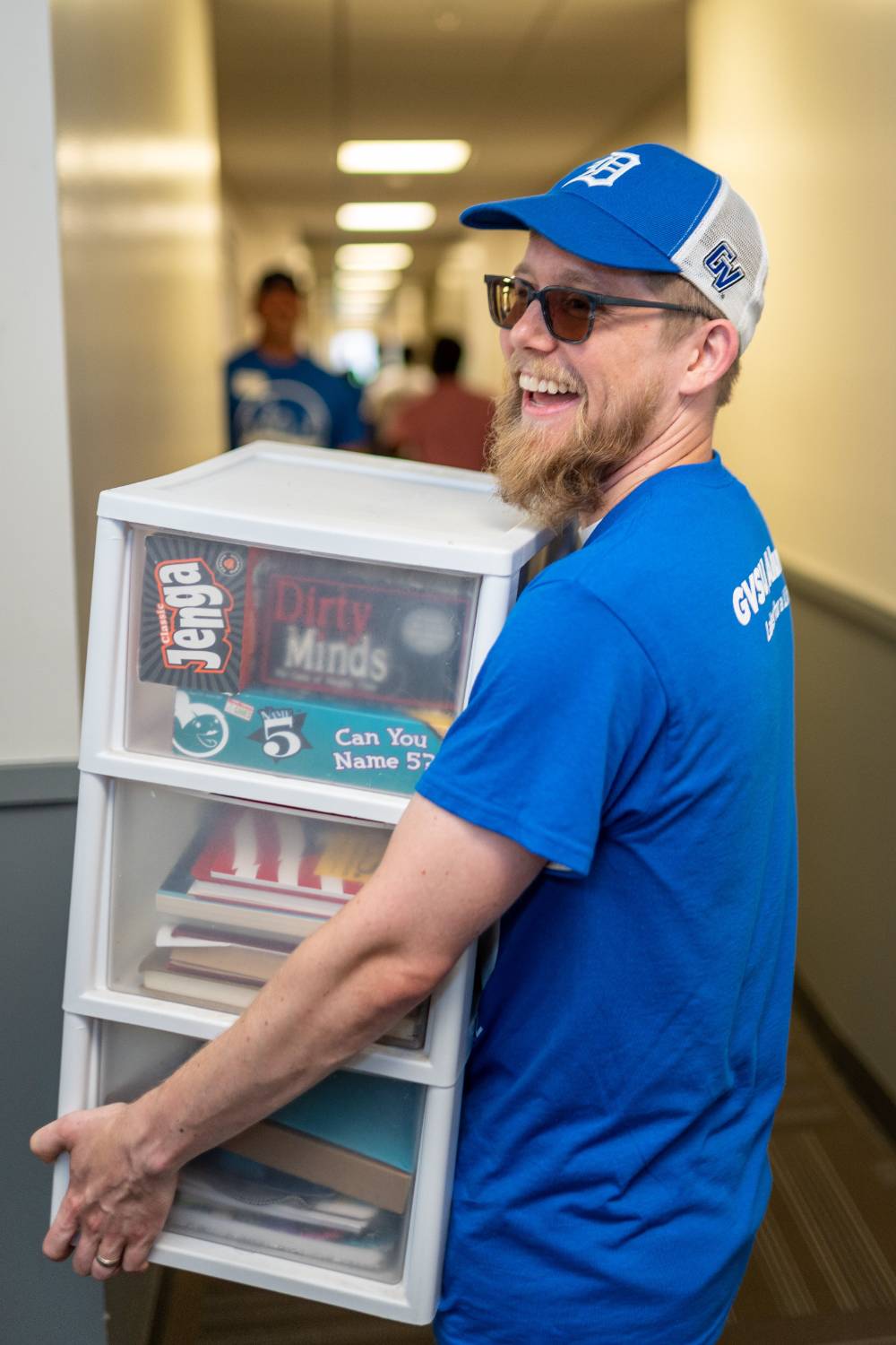 Alumn holding box with books and games